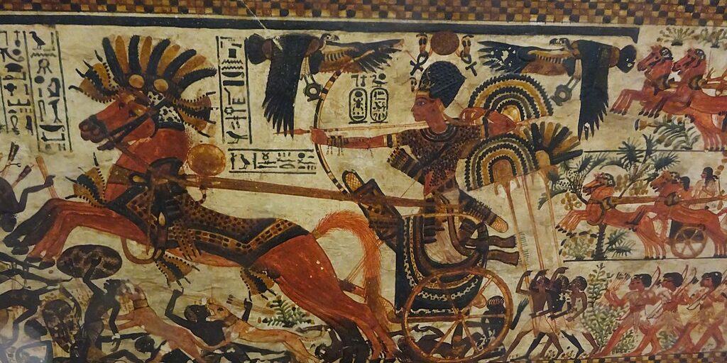 1024px-King_Tut_charging_enemies,_18th_dynasty